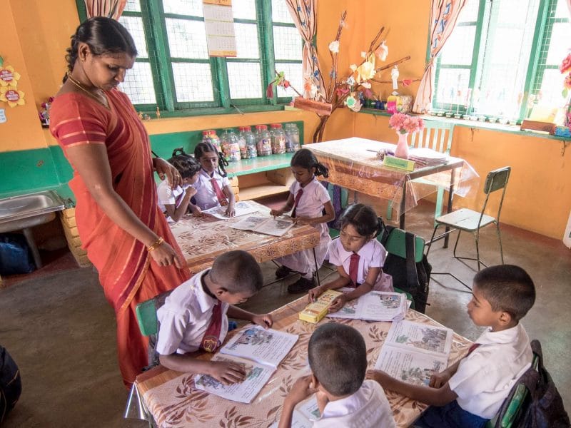 Lady teaching children in classroom in Sri Lanka