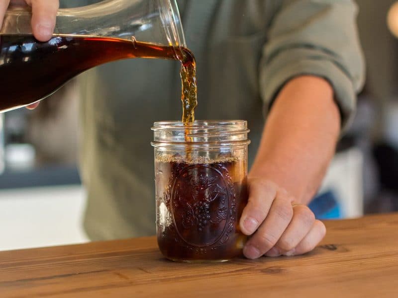 Cold Brew Coffee being poured into glass jar