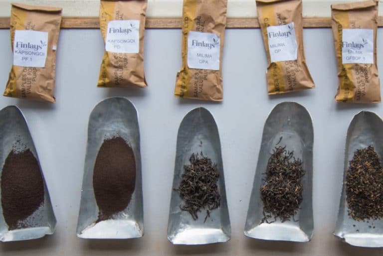 Finlays kenya tea leaves samples next to product packaging